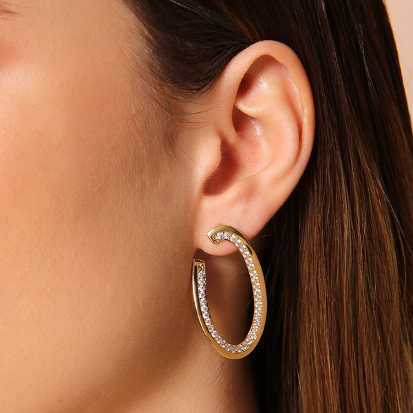 Boucles d'oreilles pendantes ovales dorées avec zircons cubiques